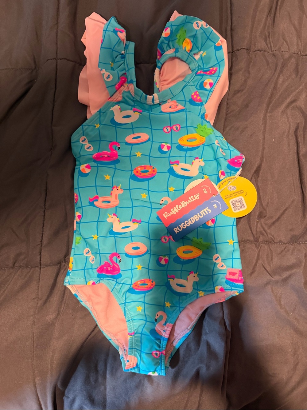 Ruffle Butts Teal One-Piece Swimsuit with Pink Ruffles and Multicolor Floaties